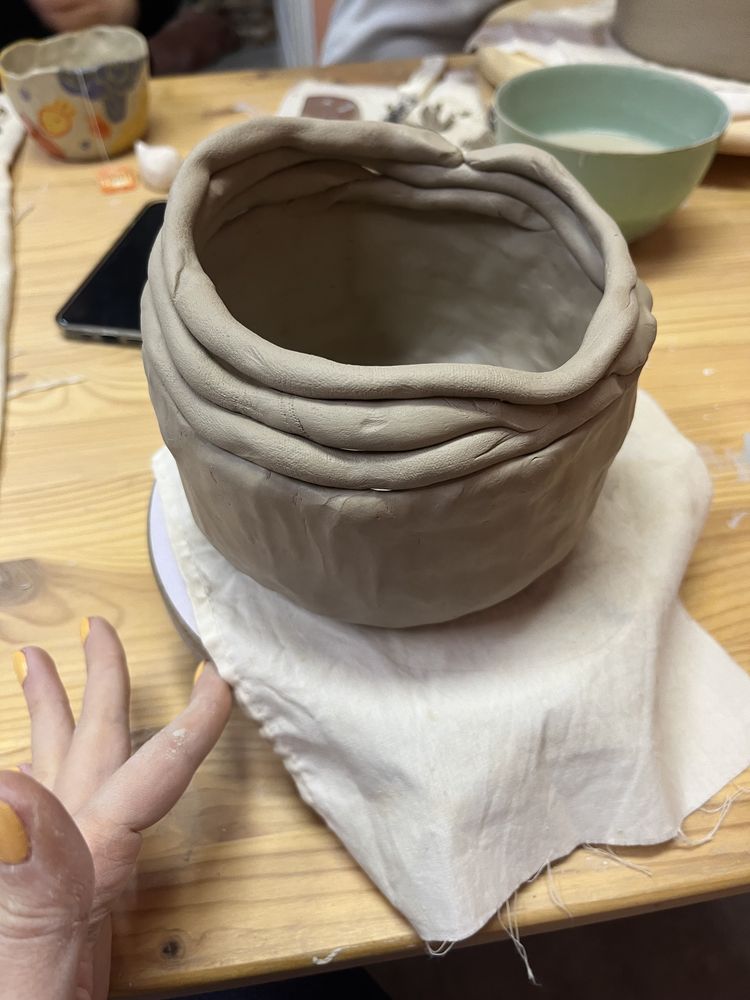 Holding unfired clay piece