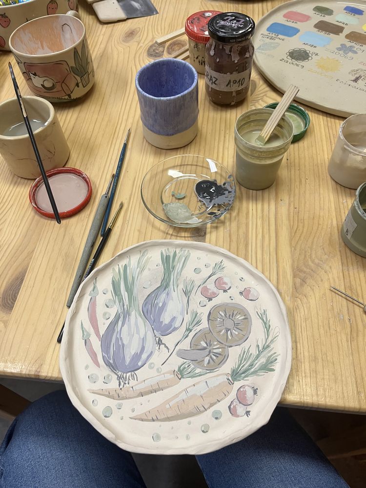 Painting vegetables on ceramic plate
