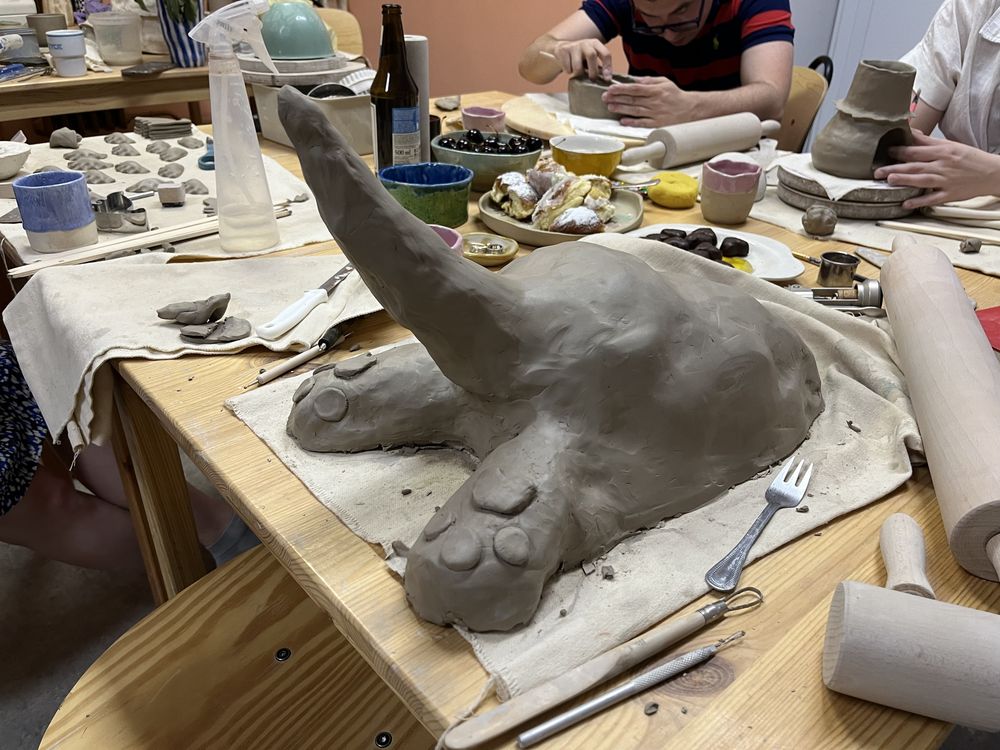 Raw clay sculpture in studio